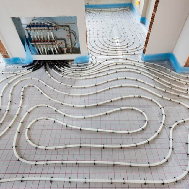 pipes of under floor heating in construction of new residential house
