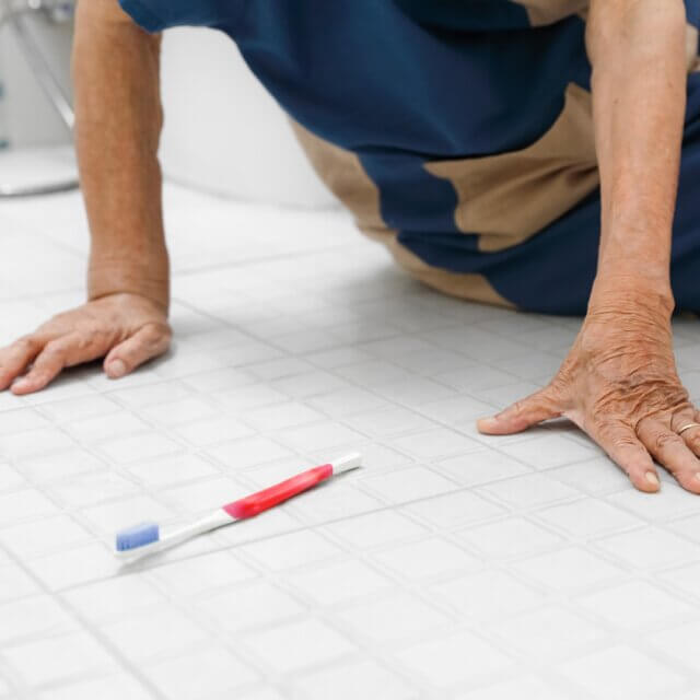 Elderly woman falling in bathroom because slippery surfaces